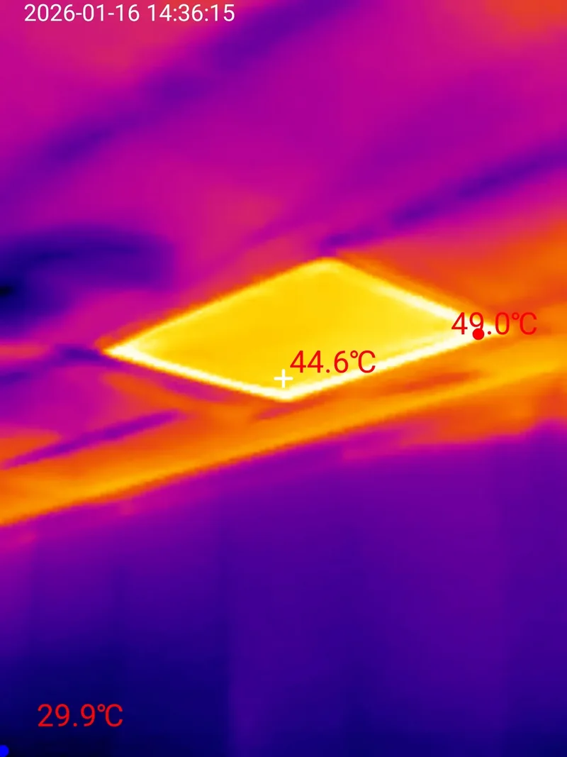 Thermal scan of a ceiling showing one glowing rectangle at 49.0 degrees Celsius where an insulation batt is missing